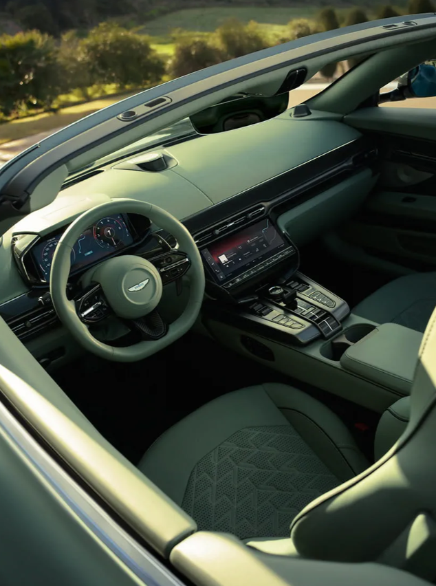 <p>Surrounded by indulgent luxury that focuses on both driver and passenger. Every control ergonomically designed. Exquisite haptic feedback complementing the advanced digital architecture for a perfect blend of digital precision and analogue beauty. A clean, commanding dashboard with design principles that accentuate Vanquish Volante’s seamless surge of power and muscularity. A direct link between the engine and the interior environment.</p>
